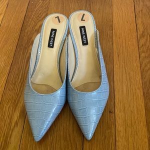 Light blue kitten mules.